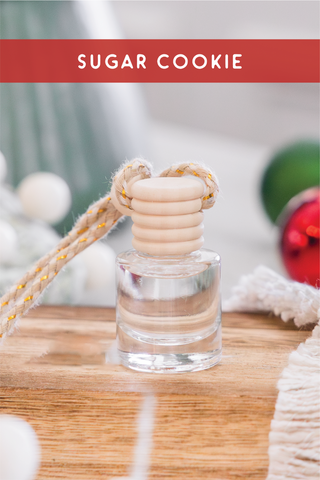 a bottle of sugar cookie sitting on top of a wooden table