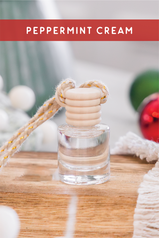 a bottle of peppermint cream sitting on top of a wooden table